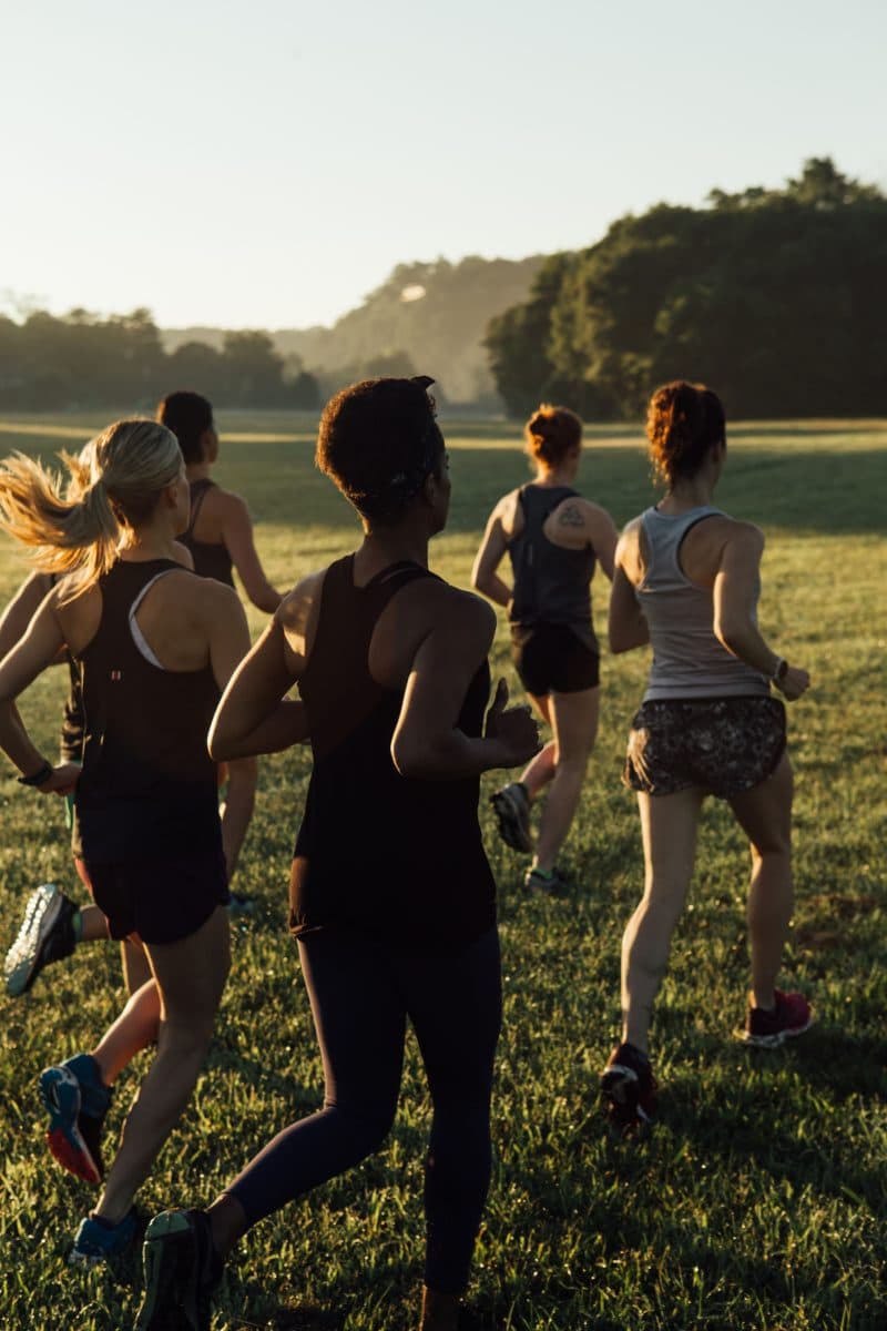 women running in a field