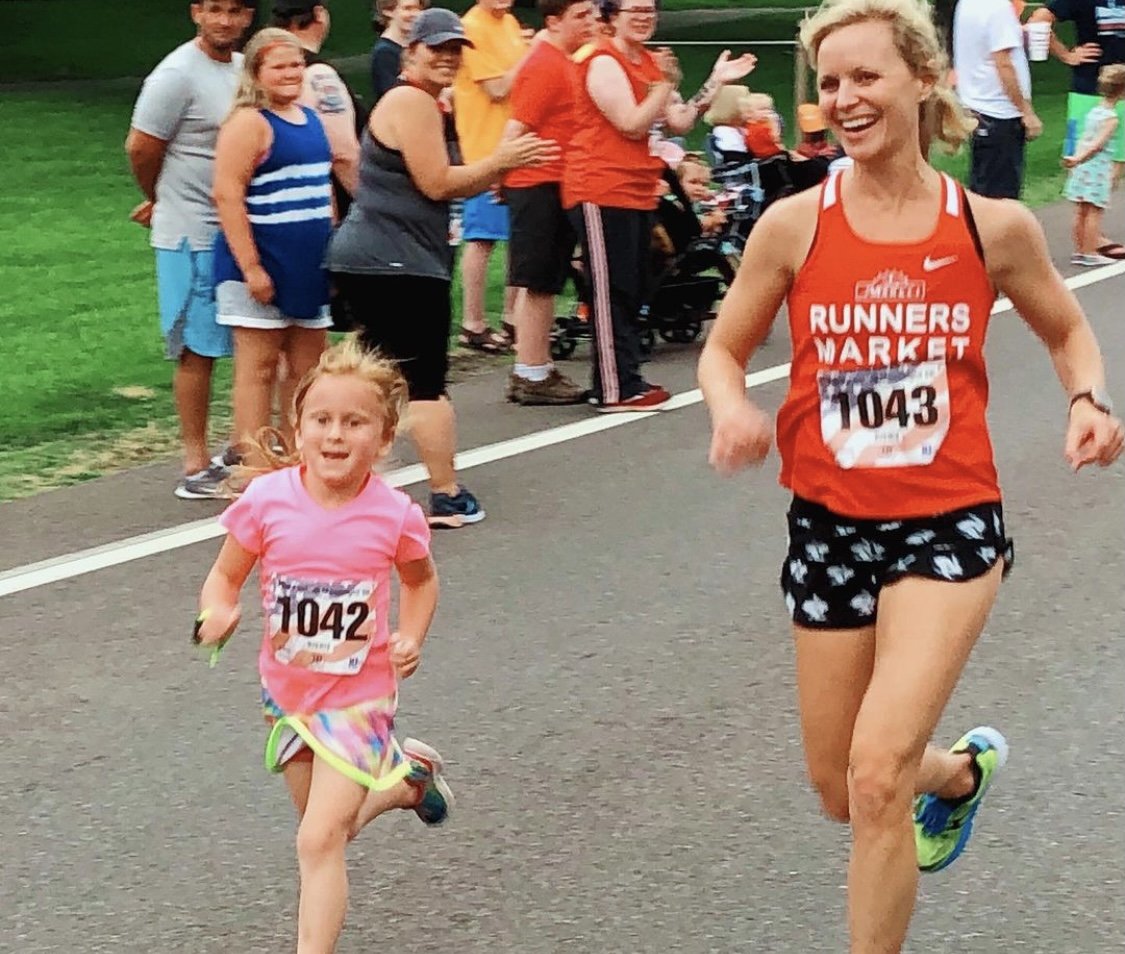 whitney running with her daughter in a race