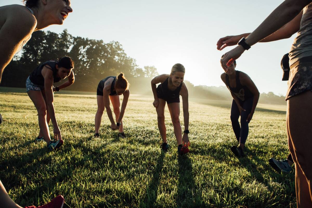 women stretching in a field