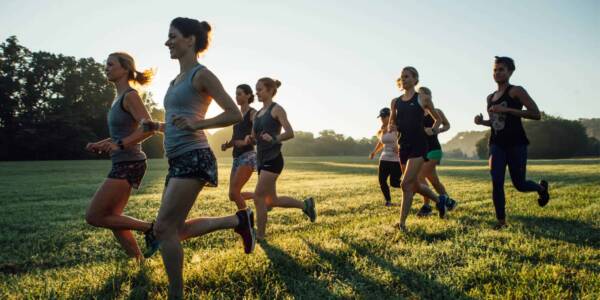 women running in a field