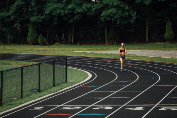 whitney on a running track