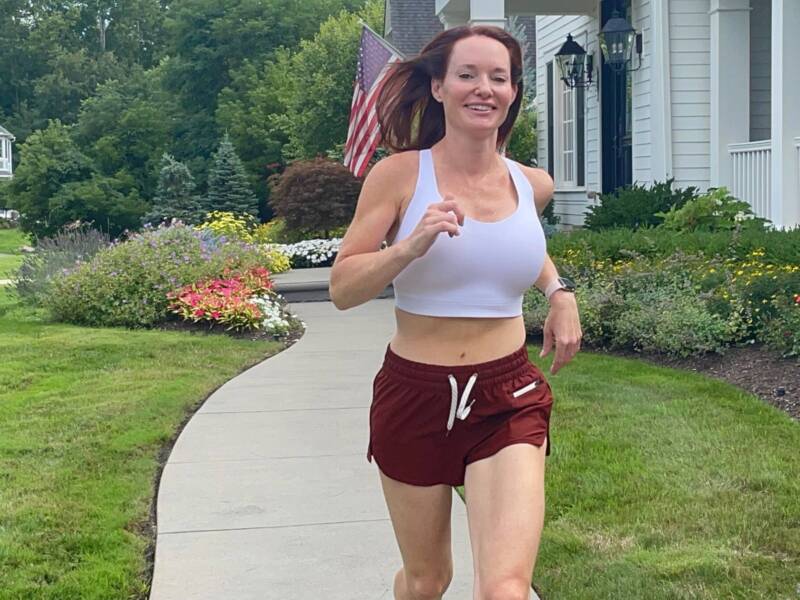 woman jogging in sports bra