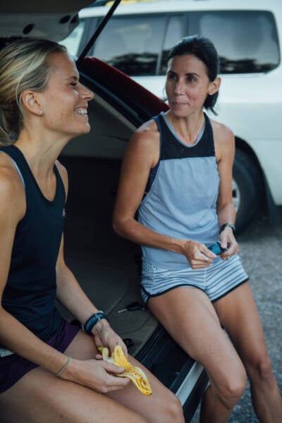 women eating in back of car