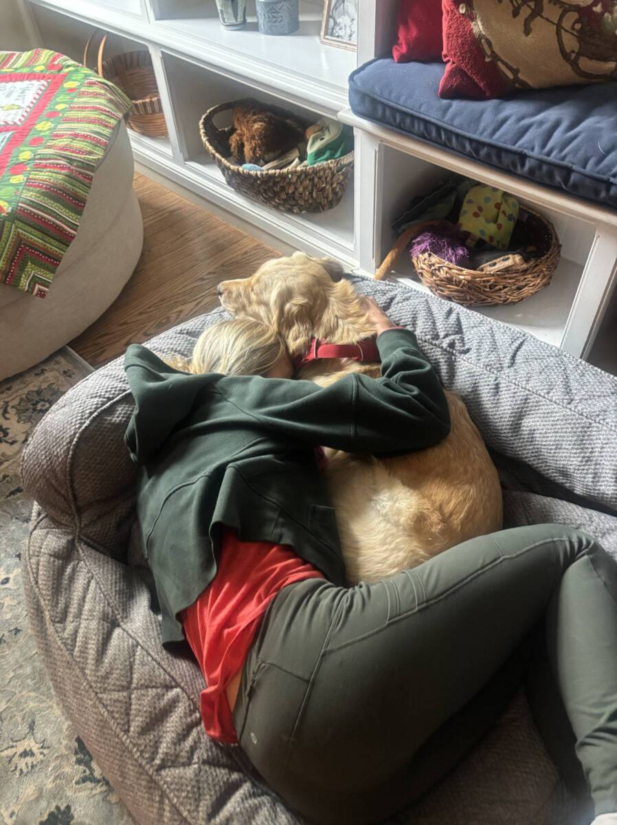 whitney snuggling with dog