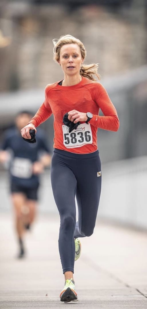 whitney in red running a marathon