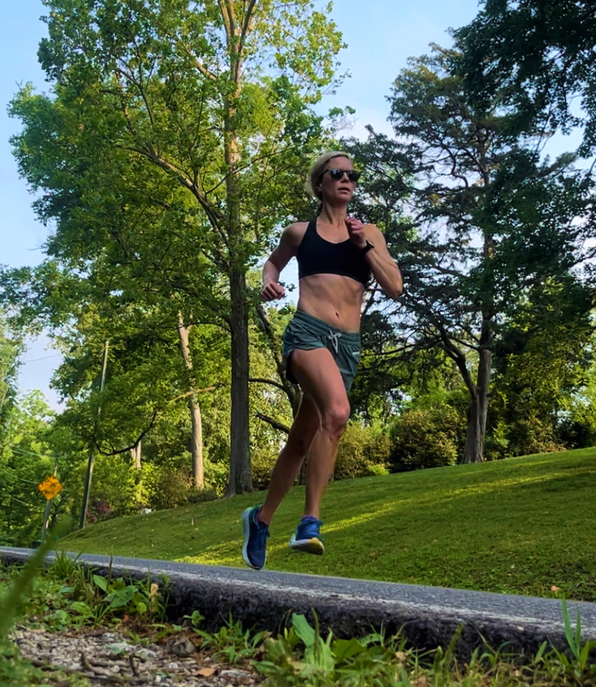 whitney running in green shorts