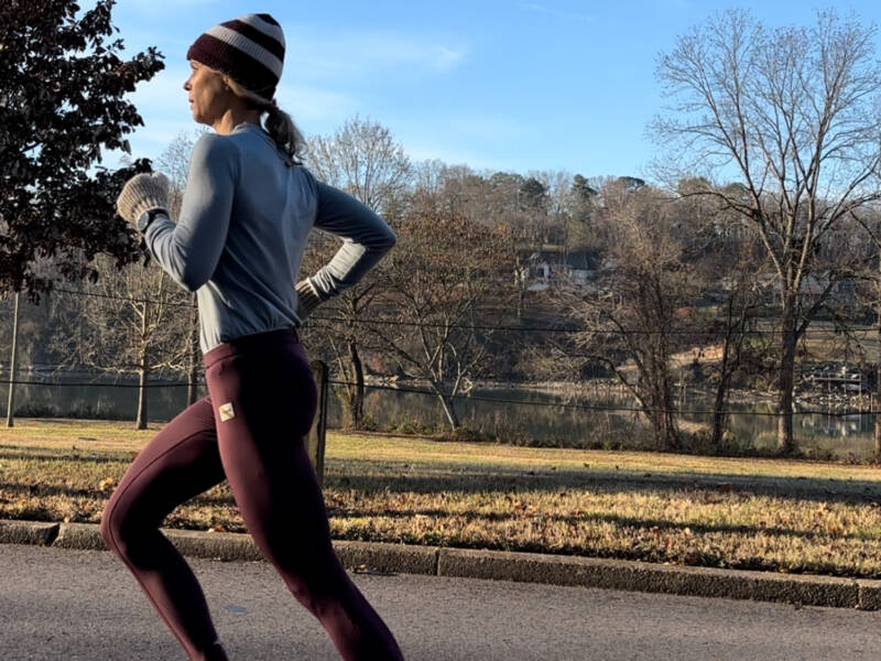 Whitney Heins running in a winter hat outside