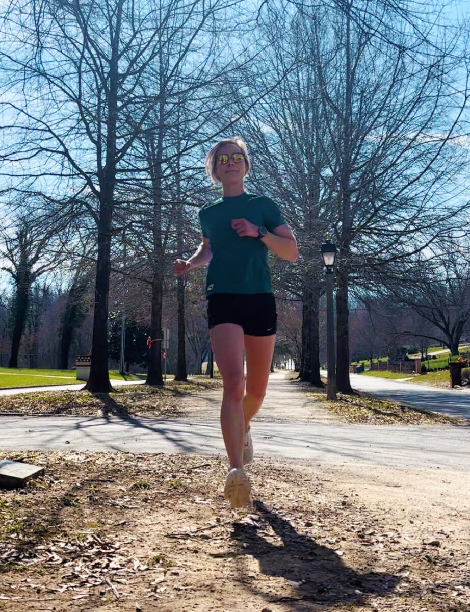 whitney running green shirt