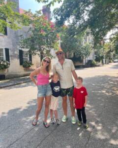 whitney with her family wearing logos