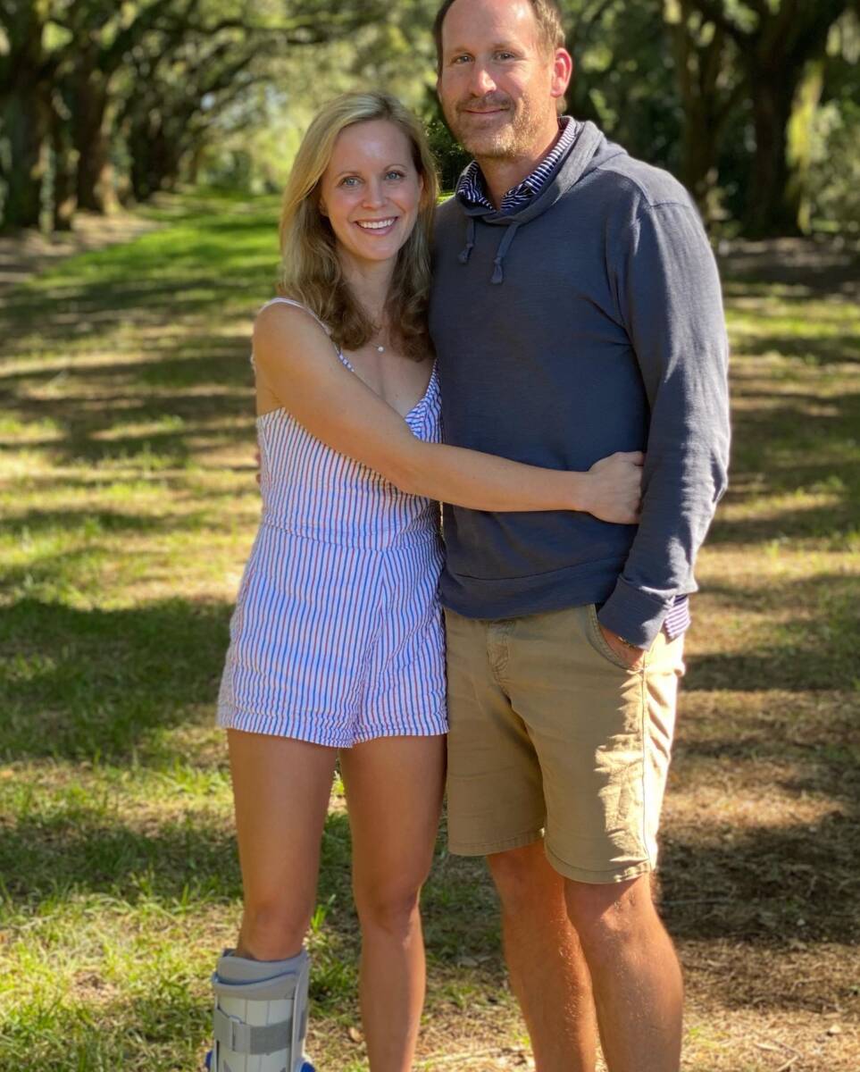 whitney with husband in a medical boot