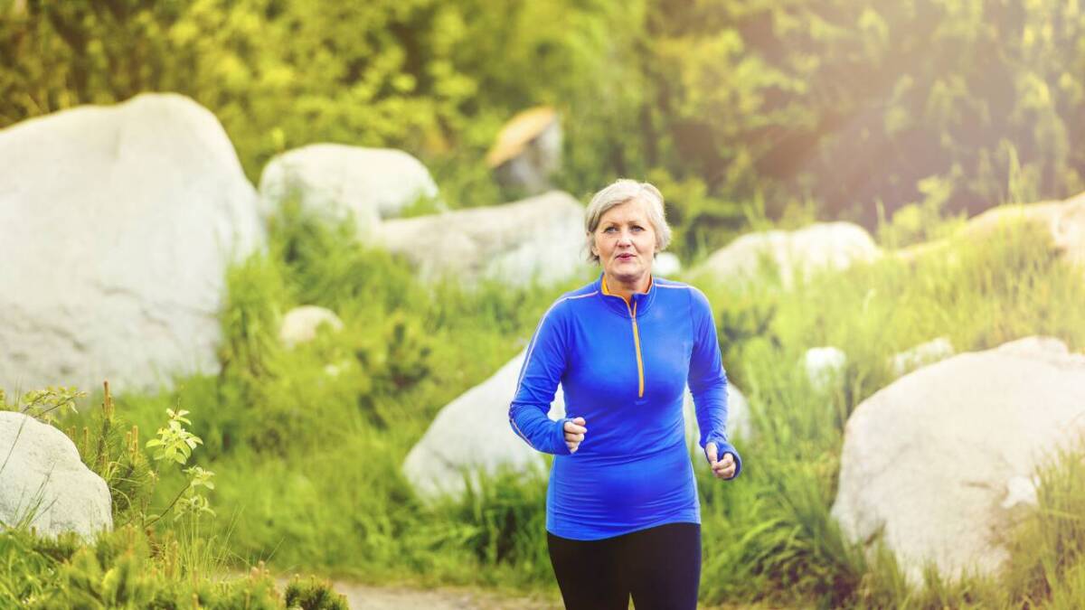 older woman running in blue