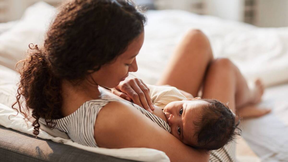 woman breastfeeding baby