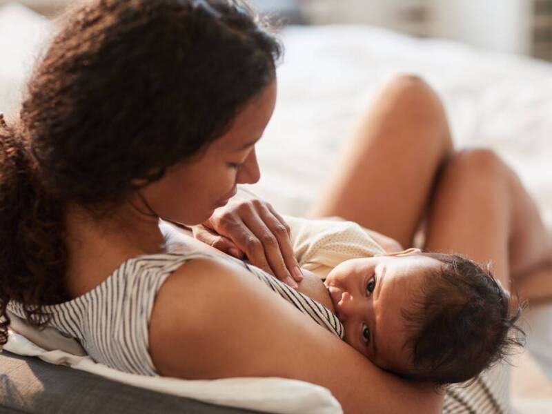 woman breastfeeding baby