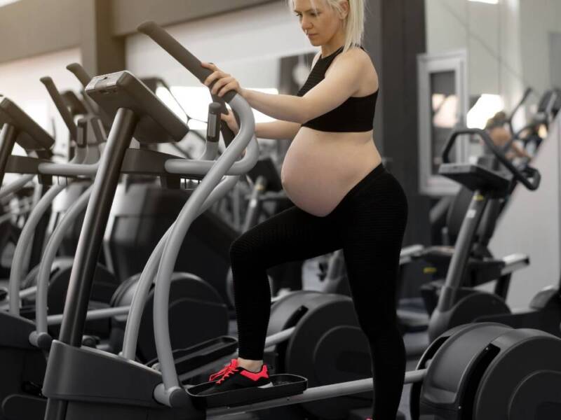 woman using the elliptical while pregnant