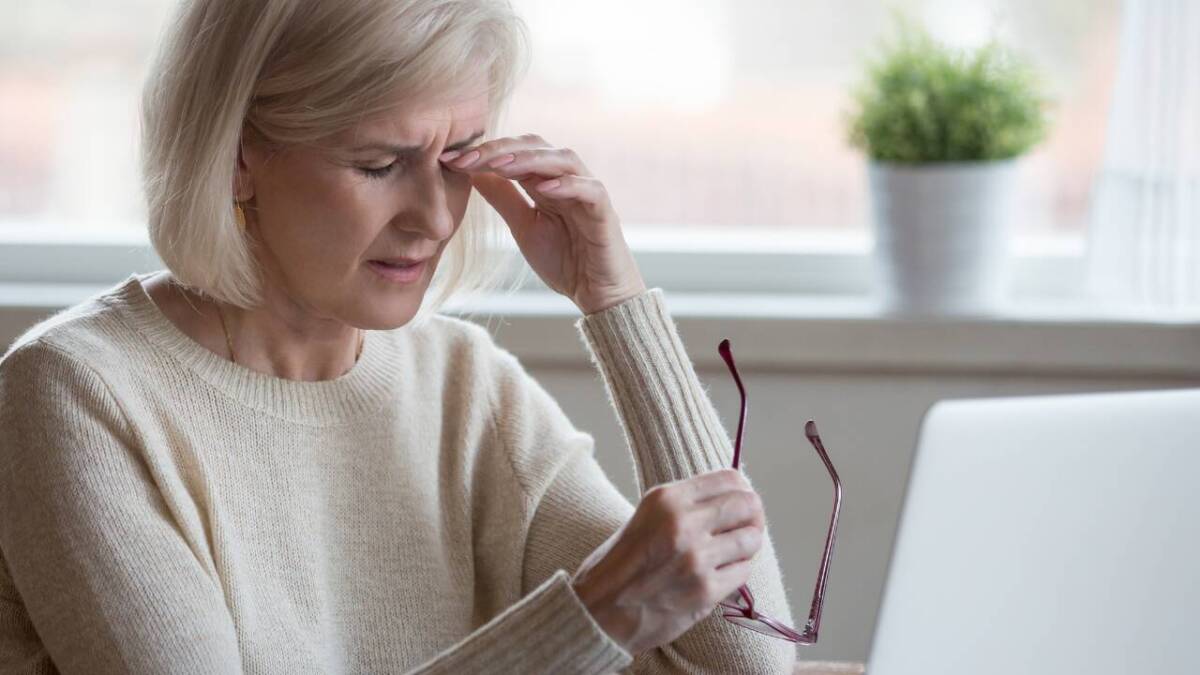 older woman looking tired