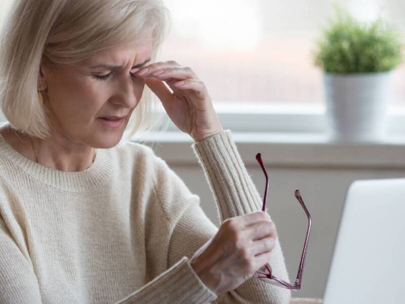 older woman looking tired