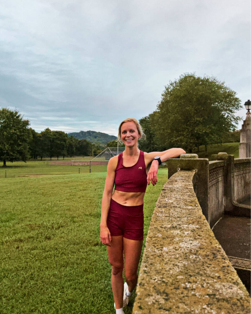 whitney in red sports bra and run shorts