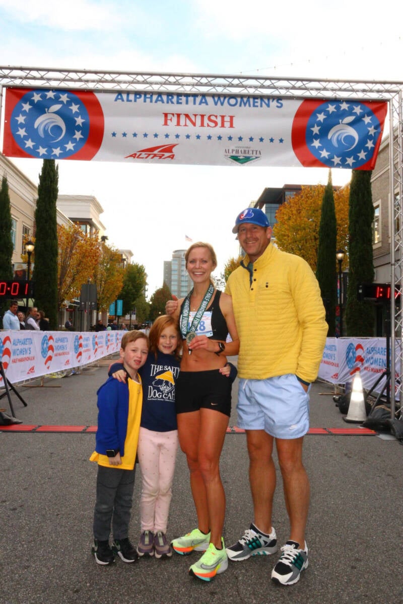 Whitney Heins with her family at the finish line.